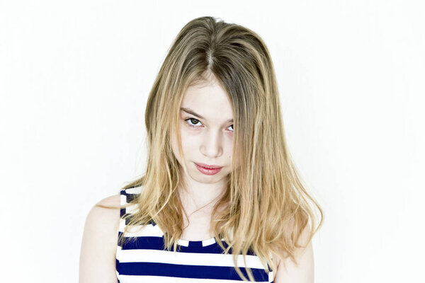 Girl with blond long hair and big eyes in striped clothes