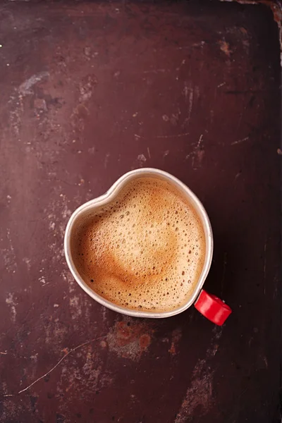 Coffee in  tin mug with glass heart — Stock Photo, Image