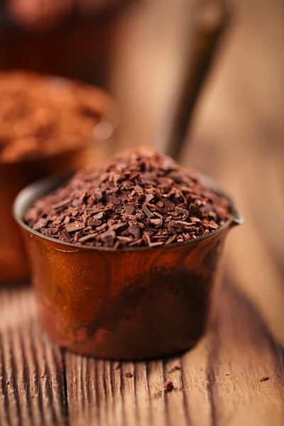 Grated chocolate, powder and cocoa beans — Stock Photo, Image