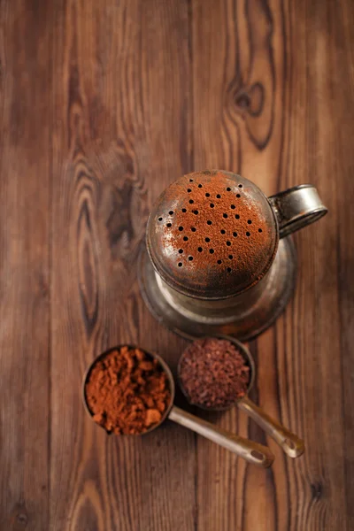 Vintage sifter with grated chocolate — Stock Photo, Image