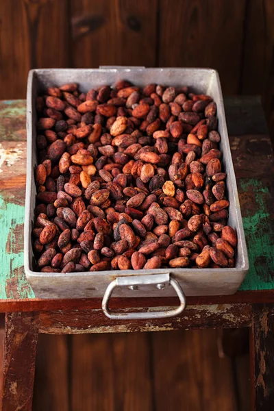 Cocoa chocolate beans in roasting pan — Stock Photo, Image