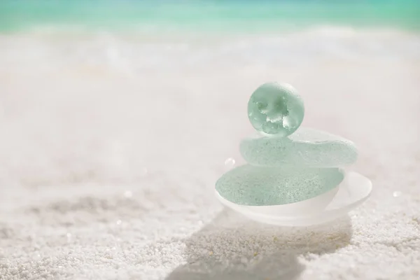 Blue sea glass with white sand beach — Stock Photo, Image
