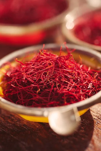 Saffron threads  in vintage dishes — Stock Photo, Image