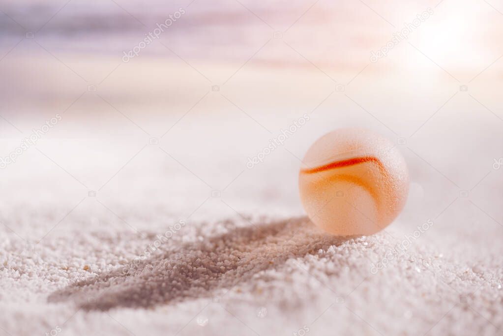 sea glass on white sand beach 