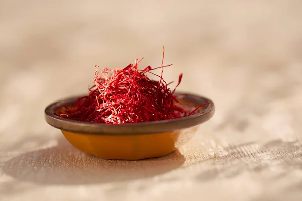 Saffron threads  in vintage dishes — Stock Photo, Image
