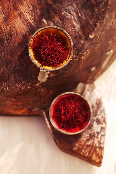 Saffron threads  in vintage dishes — Stock Photo, Image