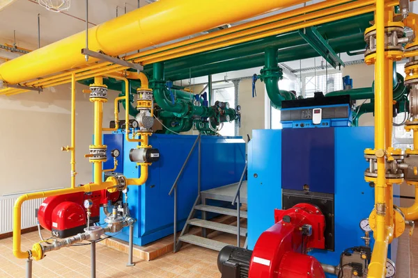Interior gas boiler house with a lot of industrial boilers, pipe