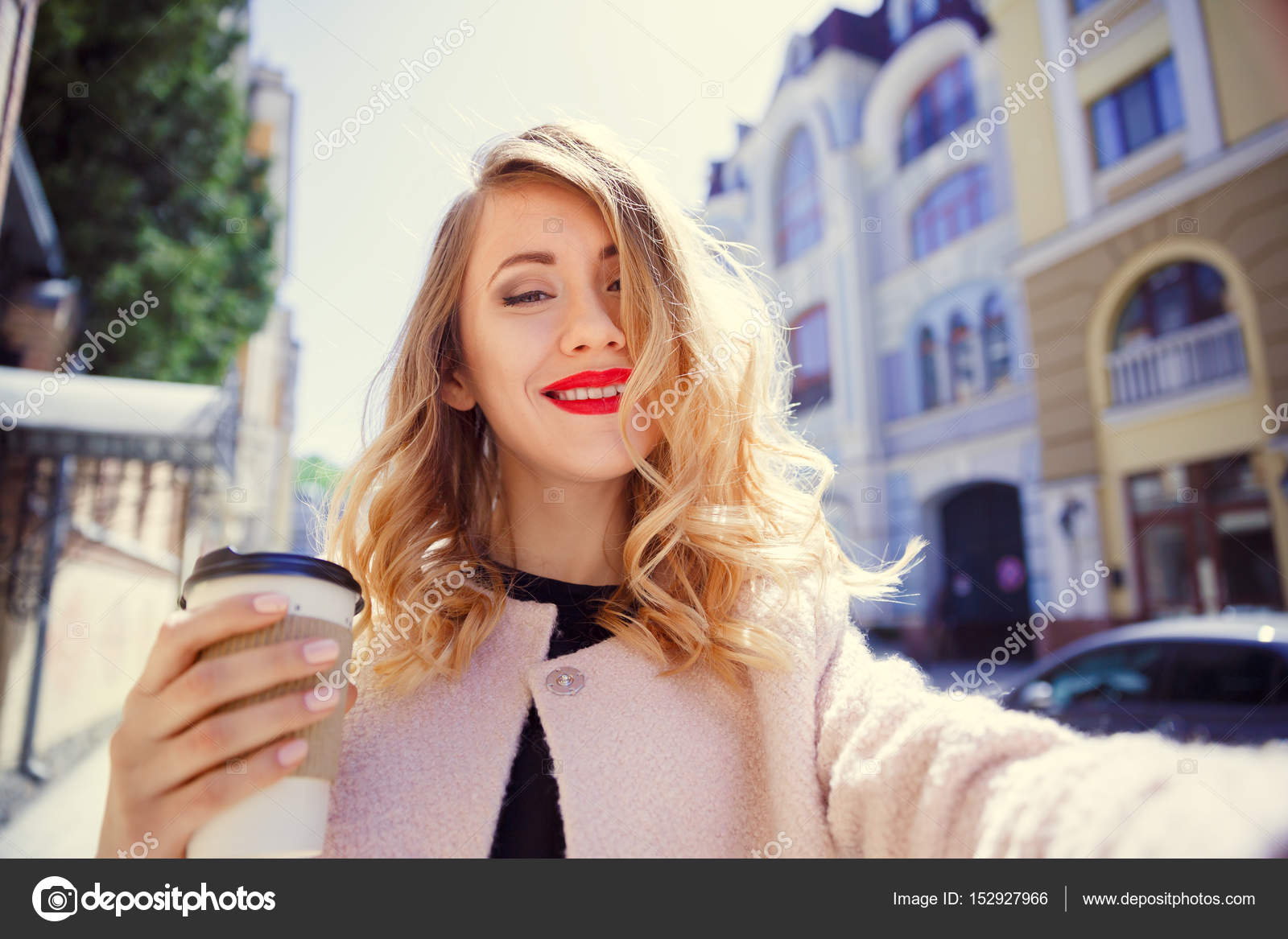  Young girl in a glass of coffee in her hand makes selfie on the — Stock ...