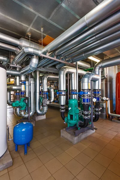 The interior of a modern gas boiler house with pumps, valves, a — Stock Photo, Image