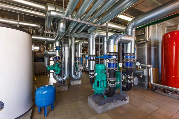 The interior of a modern gas boiler house with pumps, valves, a — Stock Image The interior of a modern gas boiler house with pumps, valves, a Stock Image