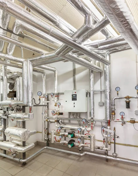 interior of an industrial boiler house, technological unit with many sensors, indicators and valves.