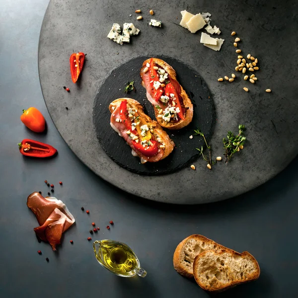 Italian sandwich/bruschetta with smoked meat and ingredients — Stock Photo, Image