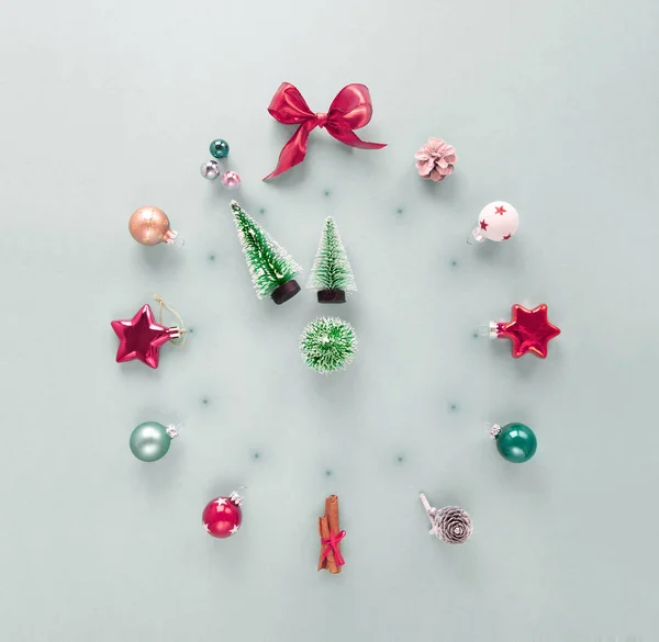 Mock Christmas clock made of xmas decorations — Stock Photo, Image