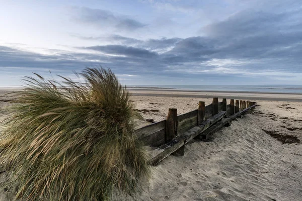 Beautiful beach coastal low tide landscape image at sunrise with — Stock Photo, Image