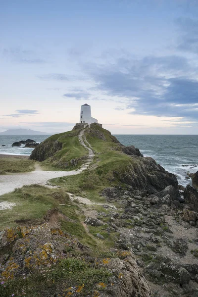 Stunning Summer landscape image of lighthouse on end of headland — Stock Photo, Image
