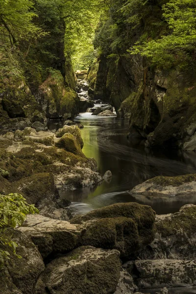 Stunning ethereal landscape of deep sided gorge with rock walls — Stock Photo, Image