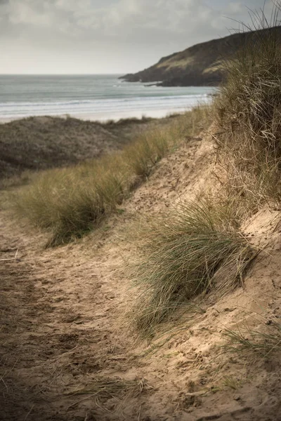 Beautiful landscape image of Freshwater West beach with sand dun — Stock Photo, Image