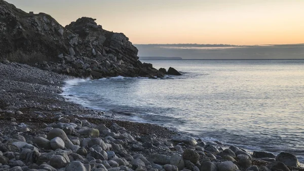 Beautiful sunrise landscape image of Church Ope Cove in Portland — Stock Photo, Image