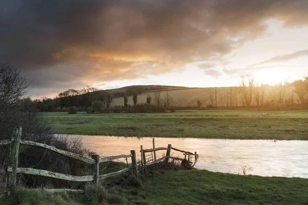 Beautiful Winter sunrise landscape of Cuckmere River winding thr — Stock Photo, Image