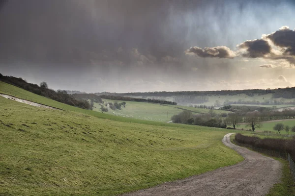 Beautiful stormy moody cloudy sky over English countryside lands — Stock Photo, Image