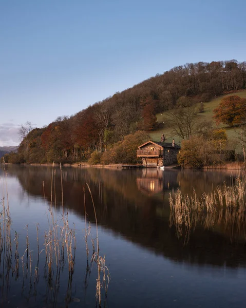 Epic vibrant sunrise Autumn Fall landscape image of Ullswater in — Stock Photo, Image