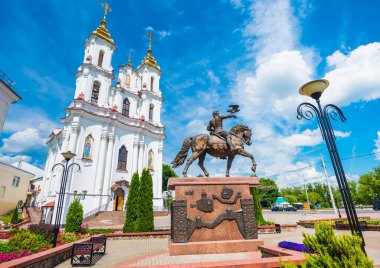 Resurrection Church and amazing equestrian statue in Vitebsk, Belarus with cloudy sky clipart
