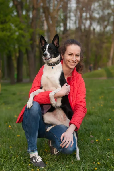 Woman and mixed breed dog portrait Stock Image