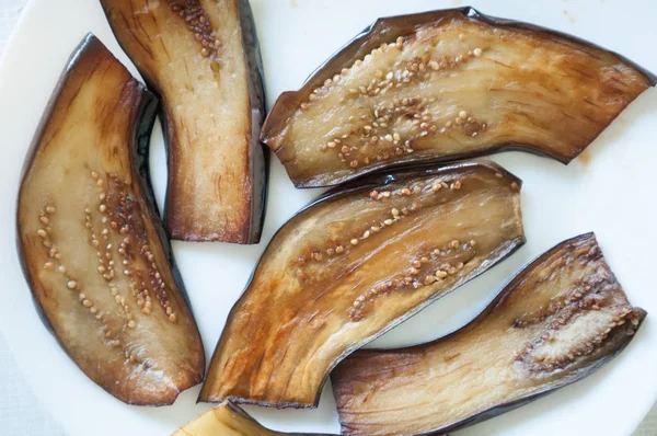 Sliced eggplant on white plate — Stock Photo, Image