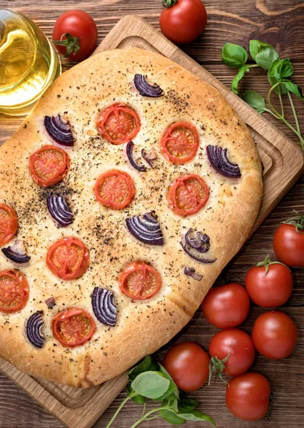 Focaccia with caramelized onion and tomato . Bread. — Stock Photo, Image