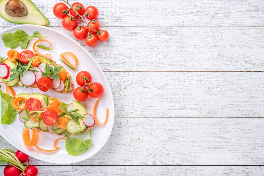 Vegan sandwich with avocado salad.