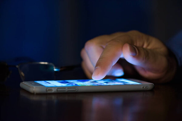 Man using smart phone.