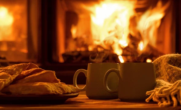 https://st3.depositphotos.com/1072614/18170/i/450/depositphotos_181703696-stock-photo-steam-cups-hot-cocoa-fireplace.jpg