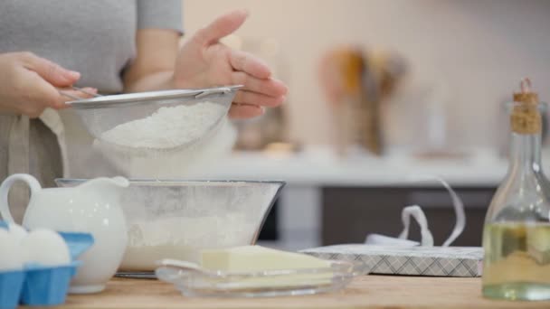 Cinemagraph Woman Sifting Flour Sieve Baking Table Lies Recipe Book — Stock Video