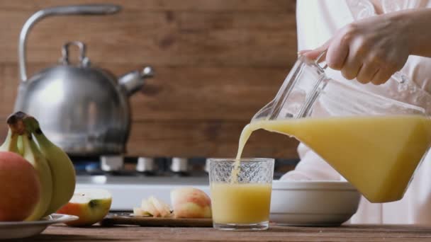 Cinemagraph Young Woman Pouring Orange Juice Glass Breakfast Motion Photo — Stock Video