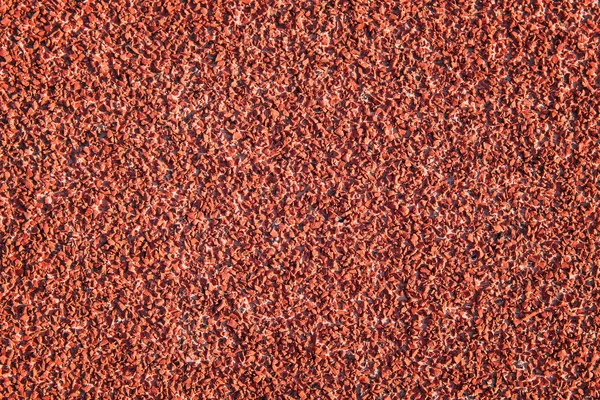 Superficie de goma de color rojo o textura de pista en ejecución — Foto de Stock