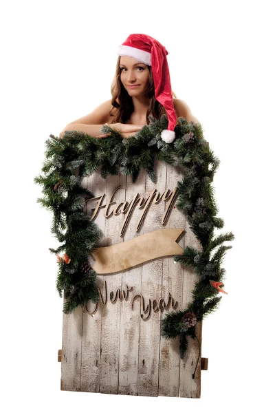 Mulher bonita em traje de Papai Noel posando em estúdio — Fotografia de Stock
