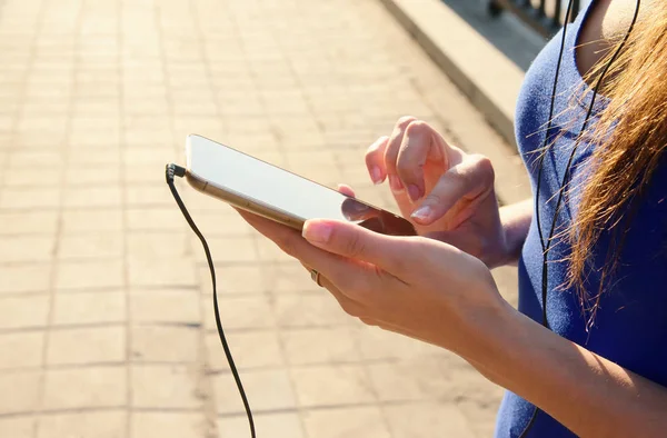 Close up of woman hands holds smart phone