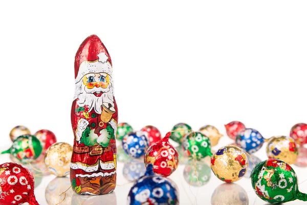Santa Claus chocolate figure with xmas decoration — Stock Photo, Image