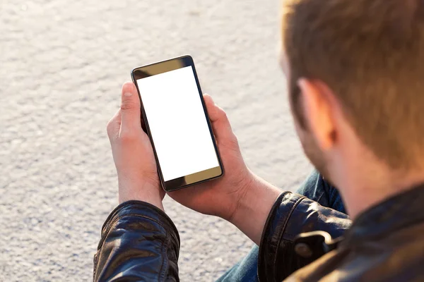 Man uses his Mobile Phone outdoor, close up