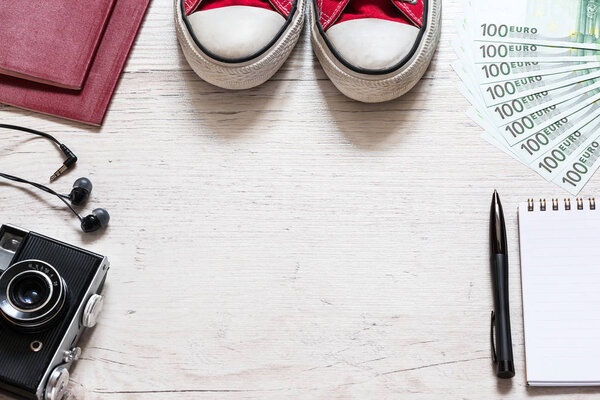 Set of travel stuff on old wooden background