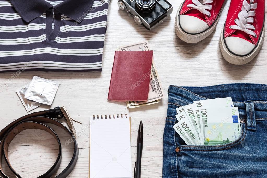 Set of travel stuff on old wooden background