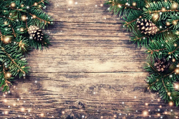 Christmas fir tree on a wooden background — Stock Photo, Image