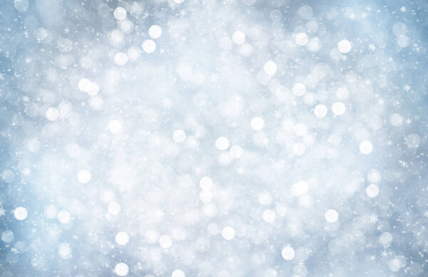 Decorative Christmas background with bokeh lights and snowflakes