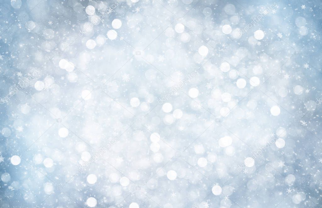 Decorative Christmas background with bokeh lights and snowflakes