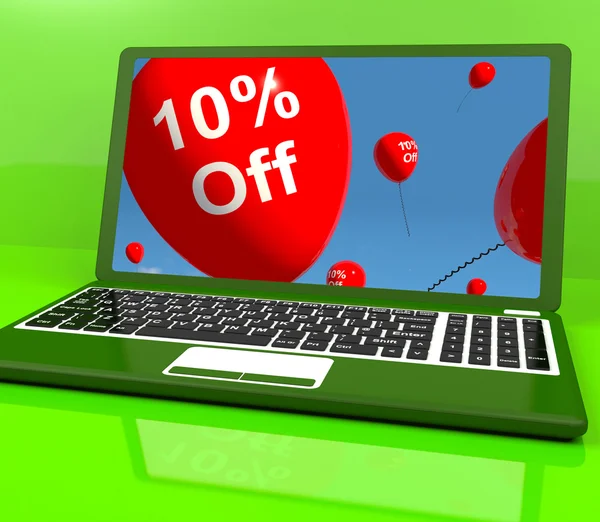 Воздушные шары на компьютере, показывающие продажи скидка 10 процентов в Интернете — стоковое фото