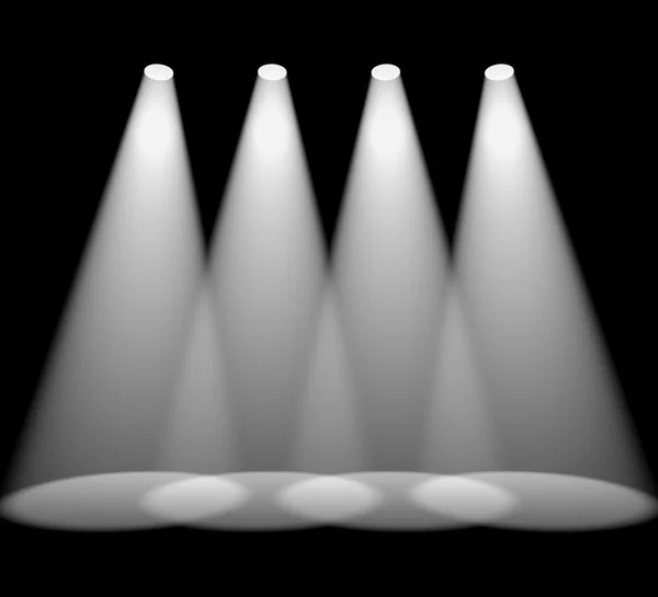 Négy fehér reflektorfény egymás után a fekete kiemelve a termék — Stock Fotó