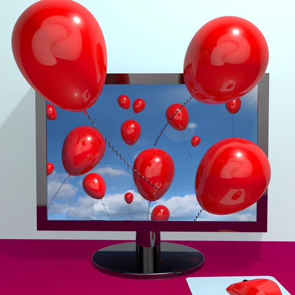 Rode ballonnen in de lucht en coming out van scherm voor online gree — Stockfoto