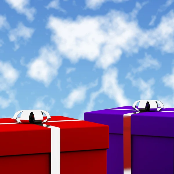 Rote und blaue Geschenkschachteln mit Himmelshintergrund als Geschenke für ihn — Stockfoto