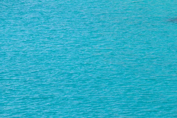 Świecąca niebieska woda fala tła — Zdjęcie stockowe