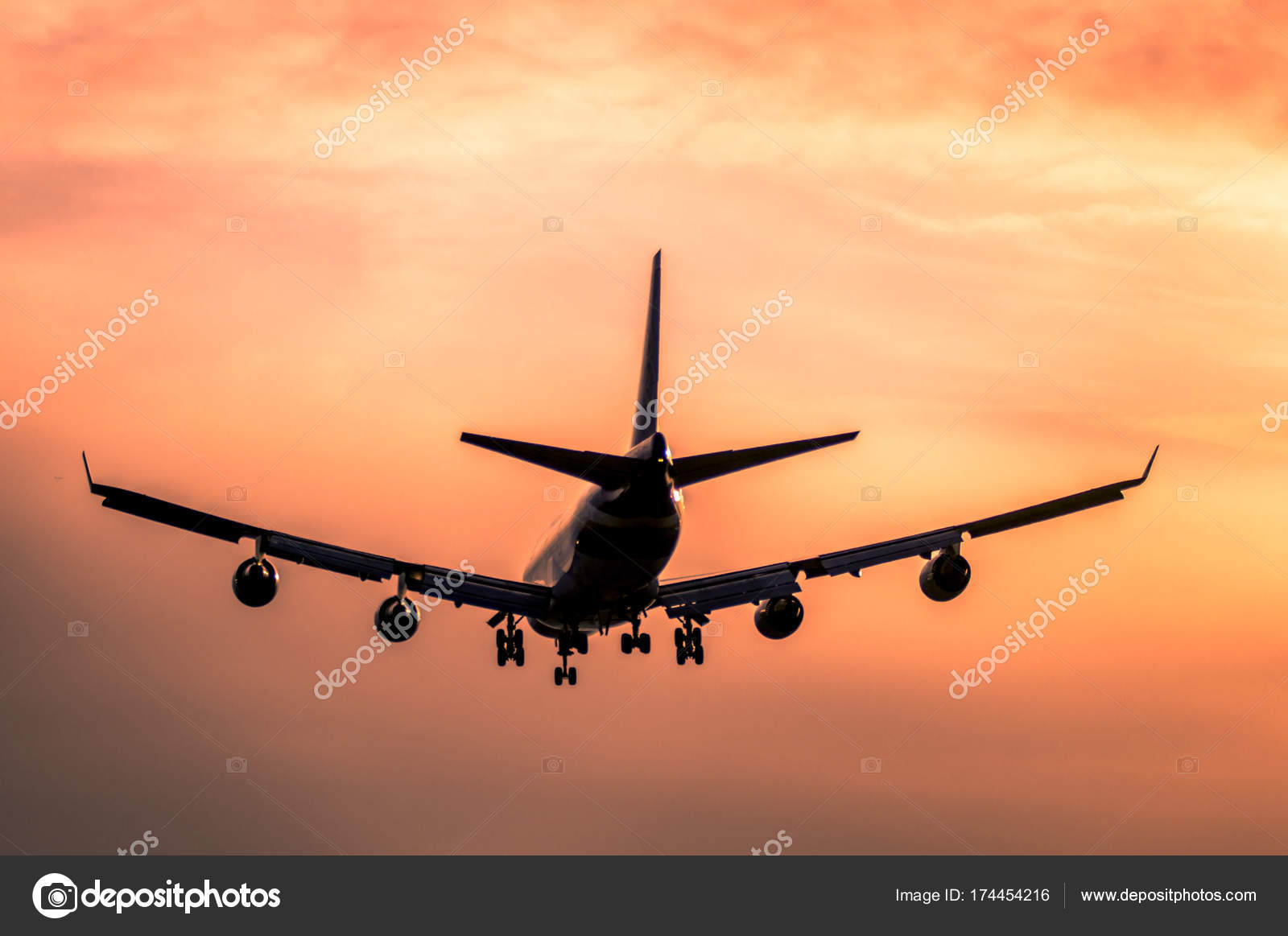 Airplane landing at sunset — Stock Photo © CAHKT #174454216
